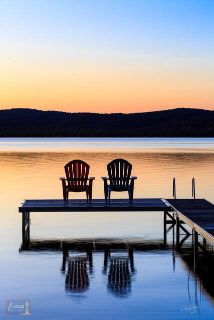 Two Adirondack Chairs on a dock at Sunset, Benzie County, Michigan
