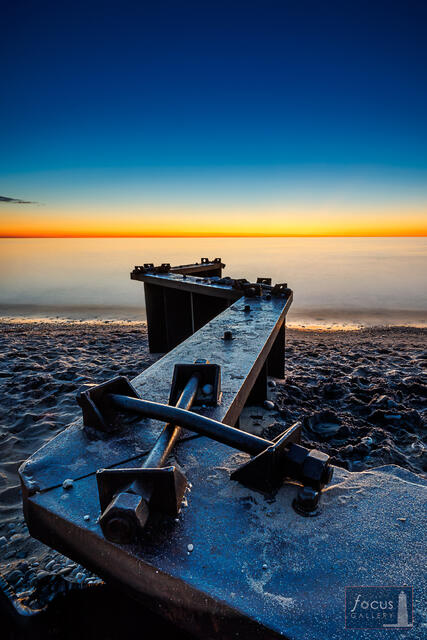 Weathered steel on the beach at Point Betsie, Lake Michigan, after sunset.