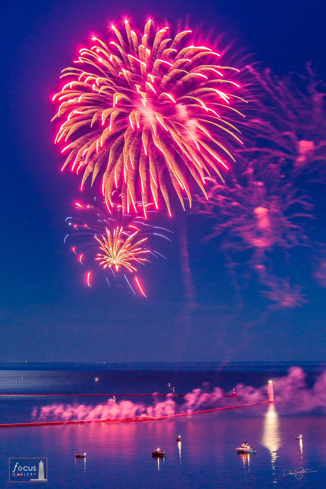 Fireworks explode over the Frankfort harbor on the Fourth of July, Frankfort, Michigan