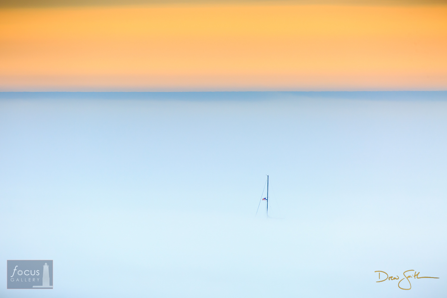 A   sailboat floats through dense fog on Lake Michigan as seen from the bluffs   north of Frankfort harbor.