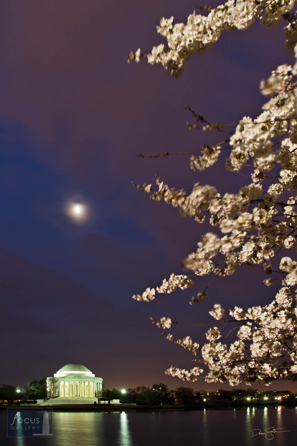 Photo © Drew Smith The moon shines over the Jefferson Memorial and cherry blossoms.