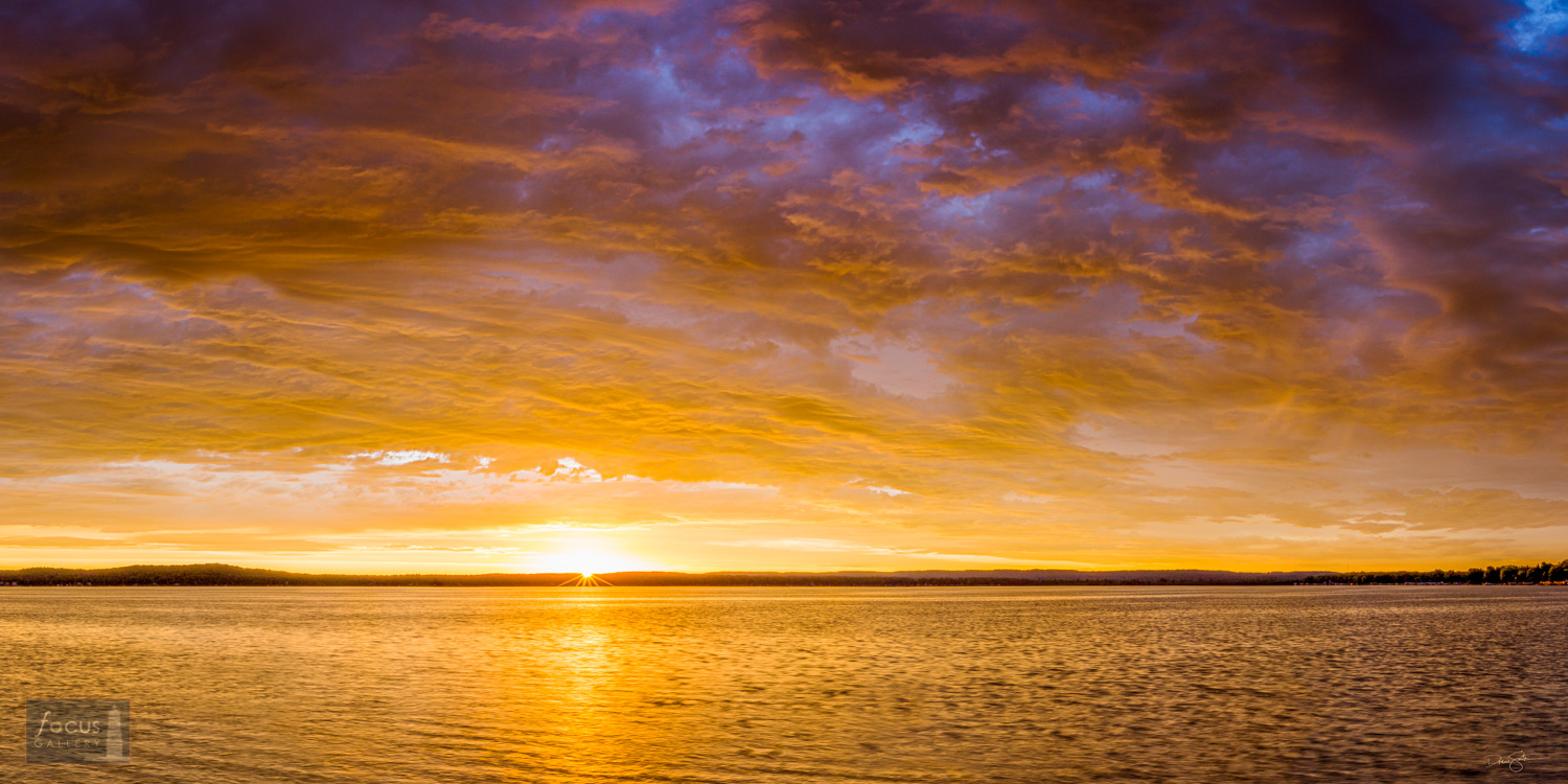 Dramatic sunrise over Platte Lake in Benzie County, Michigan.
