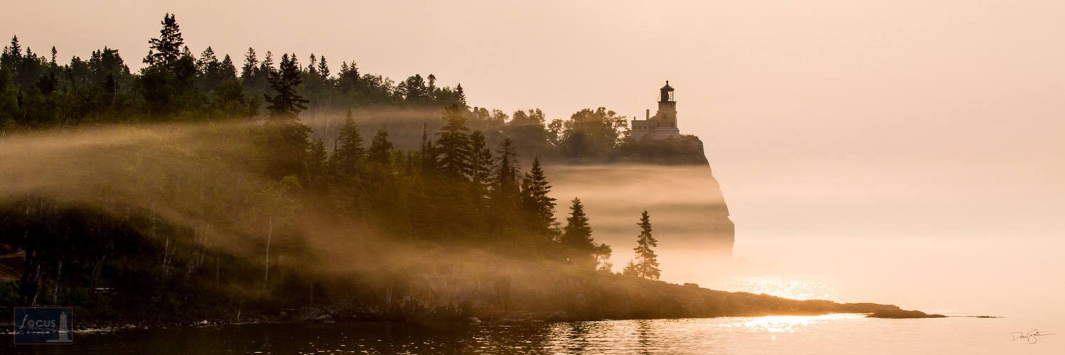 Sunrise and fog at Split Rock Lighthouse on Lake Superior.