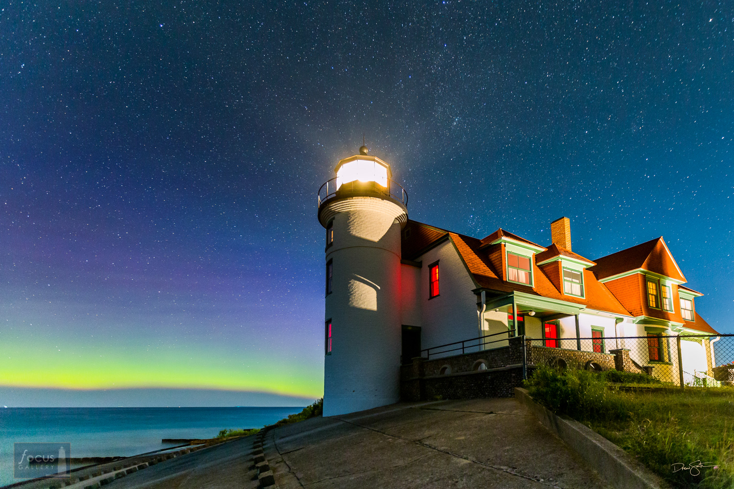 Aurora borealis over Lake Michigan and the Point Betsie Lighthouse.