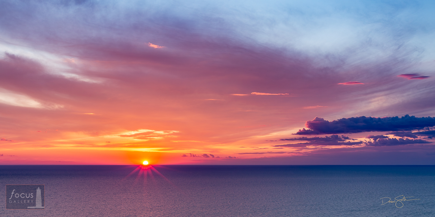 A   luscious, colorful sunset over Lake Michigan as seen from the Lake Michigan   Overlook.