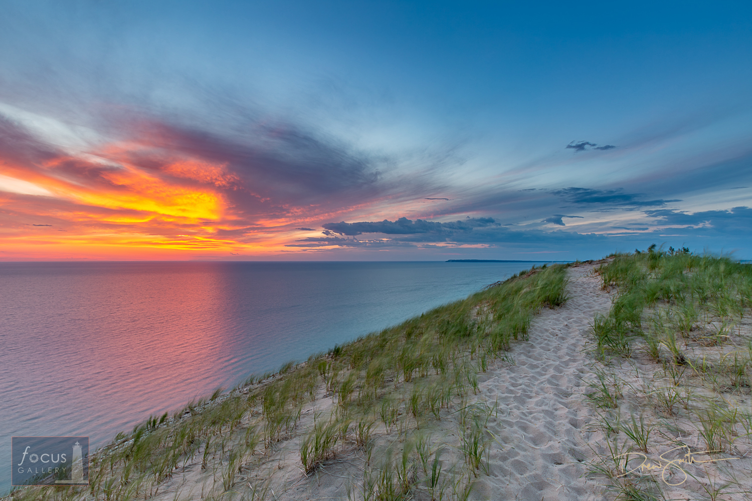 A sandy   trail leads to epic sunset views on Sleeping Bear dune at the Lake Michigan   overlook.